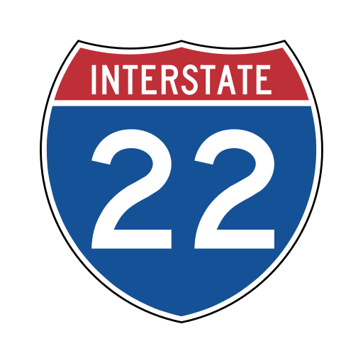A shield-shaped sign has a red top band with the white word INTERSTATE and a blue lower part with a large white number.