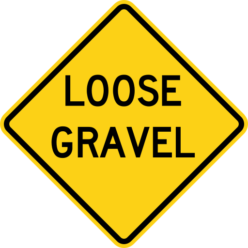 A yellow diamond sign with a black border and the black words LOOSE GRAVEL on two lines.