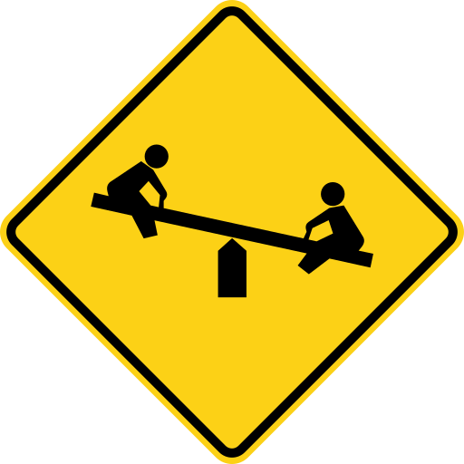 A yellow diamond sign with a black border and a black symbol of two children on a seesaw.