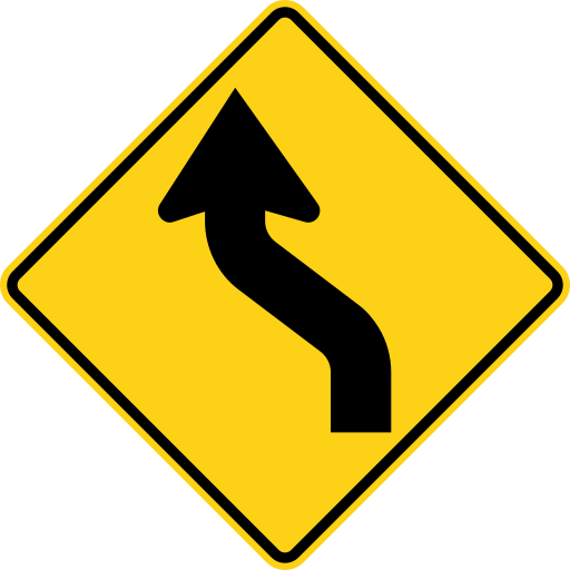A yellow diamond sign with a black arrow that bends to the left, then bends back to the right and points up.