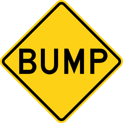 A yellow diamond sign with a black border and the single black word BUMP.