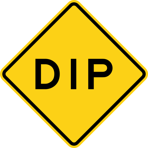 A yellow diamond sign with a black border and the black word DIP.