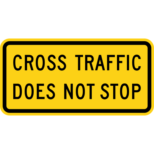 A yellow horizontal rectangle plaque with a black border and the black words CROSS TRAFFIC DOES NOT STOP on two lines.